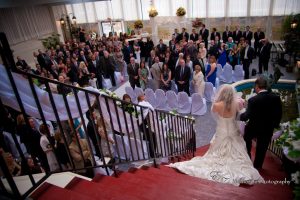 Bride Walking down the stairs in the Garden Room