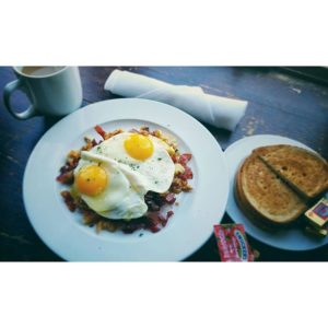 Sunny side up eggs over corned beef hash